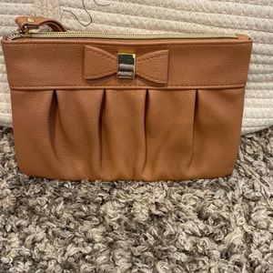Brown bow tie clutch